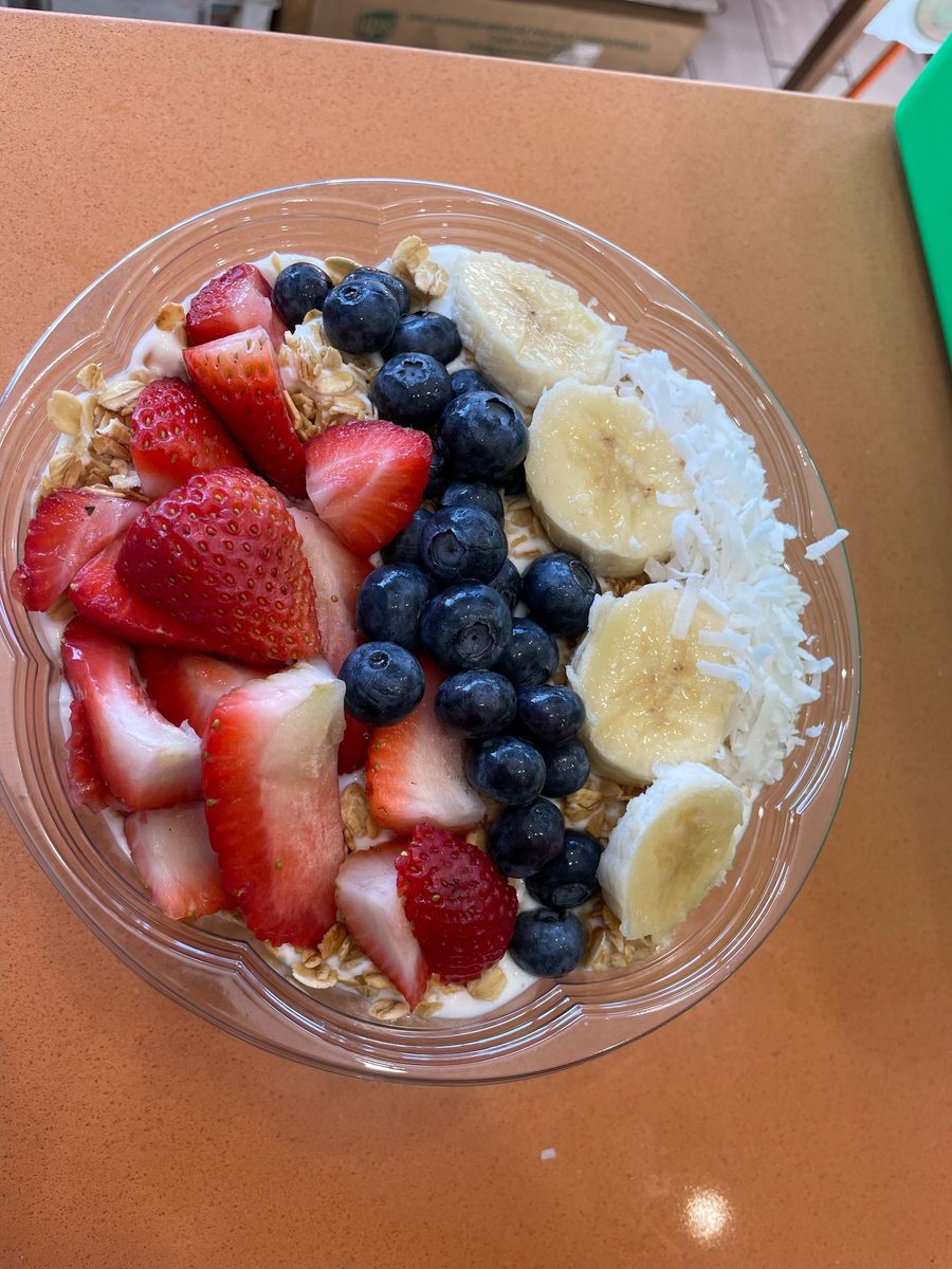 Açaí bowl topped with fresh berries, banana and coconut